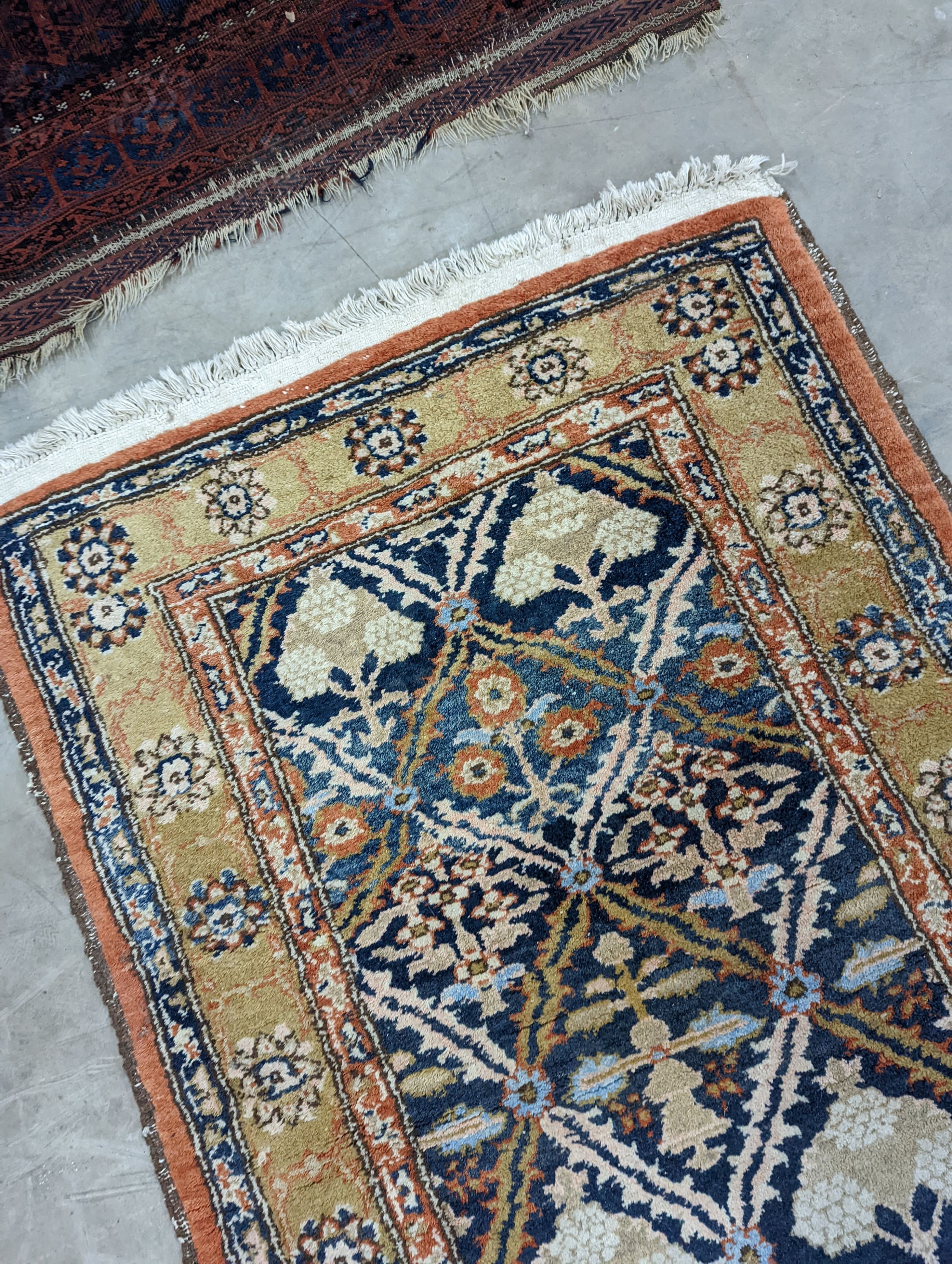 An Afghan brick red ground geometric runner and a smaller Afghan rug, larger 306 x 106cm